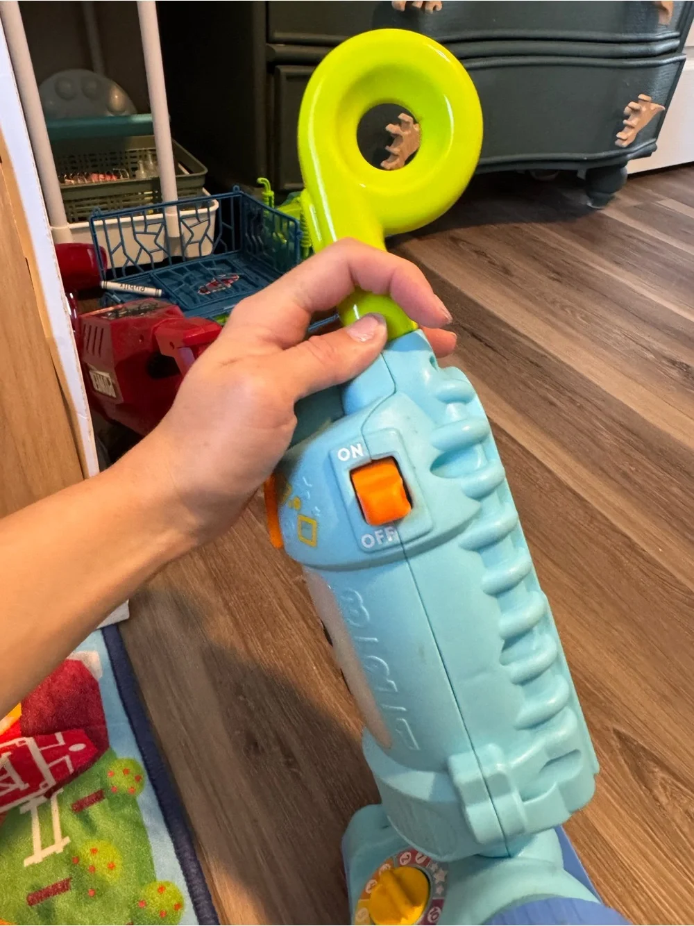 Fisher-Price Light Blue Toy Vacuum with Yellow-Green Handle and Purple Wheels